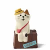 Cute cat figurine with a yellow hat and a suitcase for all his adventures made by Decole Japan.
